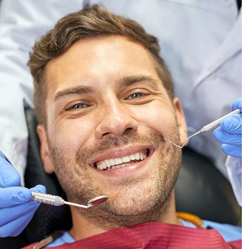 Man grinning in the dental chair
