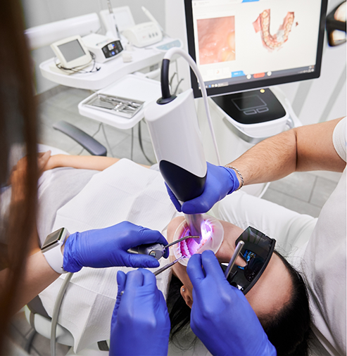 Dentist capturing close-up photos of a patient's teeth