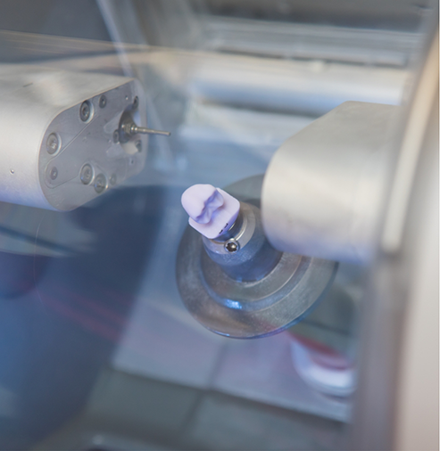 Milling machine creating a dental crown