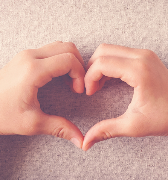 Two hands making the shape of a heart