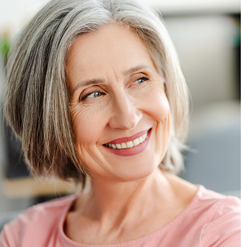 Smiling woman with straight gray hair