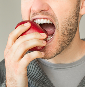 Man eating an apple