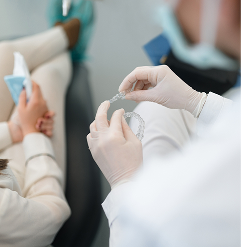 Dentist showing Invisalign to a patient