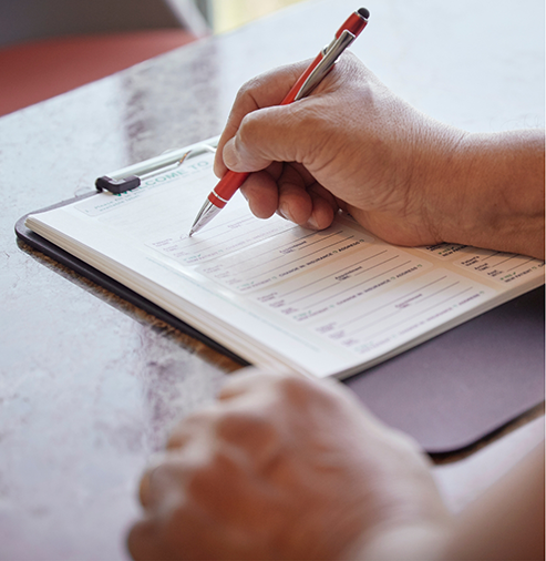 Person filling out paperwork
