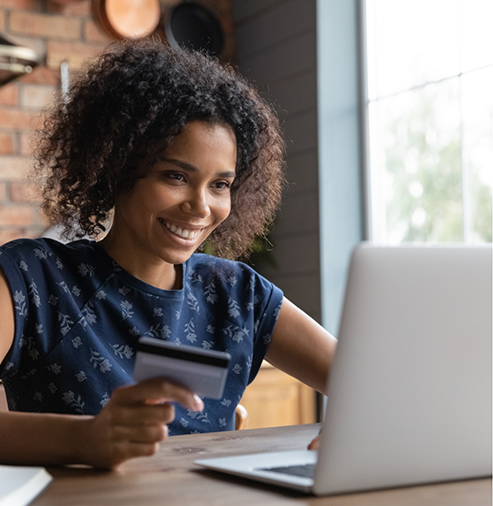 Woman using a laptop at a table