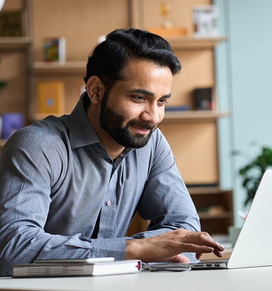 Man using a laptop at a table