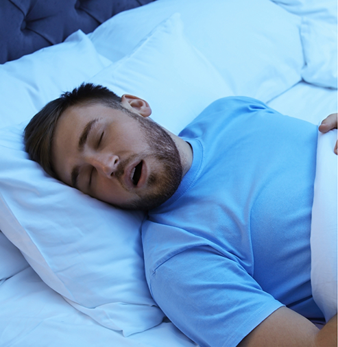 Man sleeping on his back with his mouth open