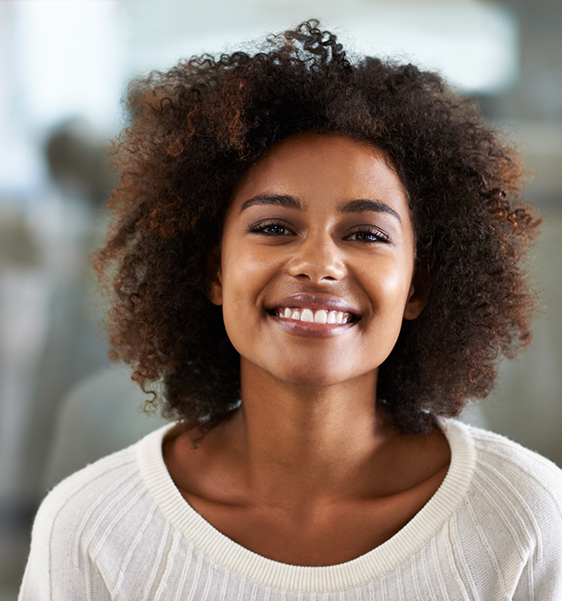 Smiling woman in a white sweater