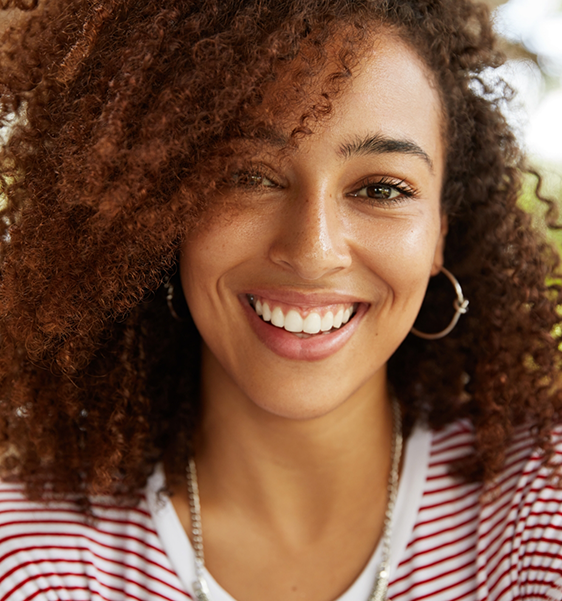 Young woman smiling with veneers in Alexandria